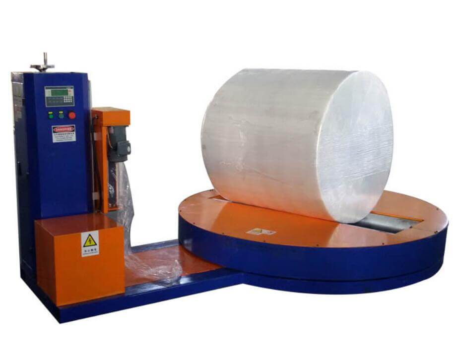 Turntable rolls and reels wrapping machine