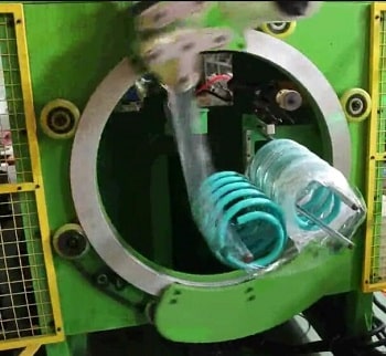 Spring wrapping machine, spring stretch wrapper